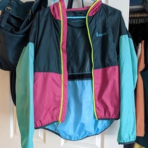 Cotopaxi teal and pink windbreaker